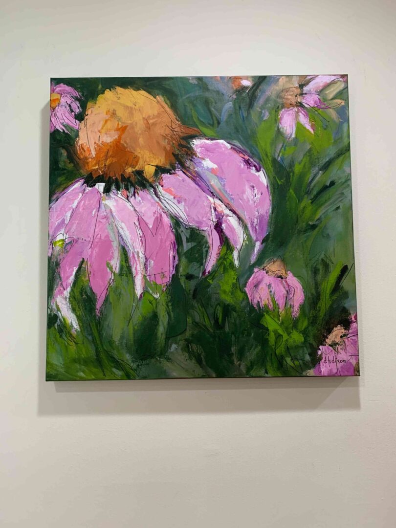 A painting of flowers on the wall