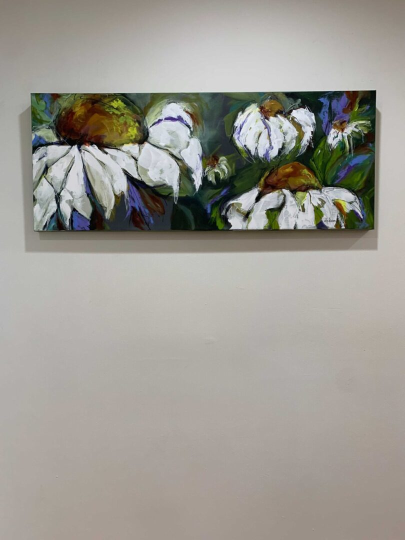 A painting of white flowers on the wall