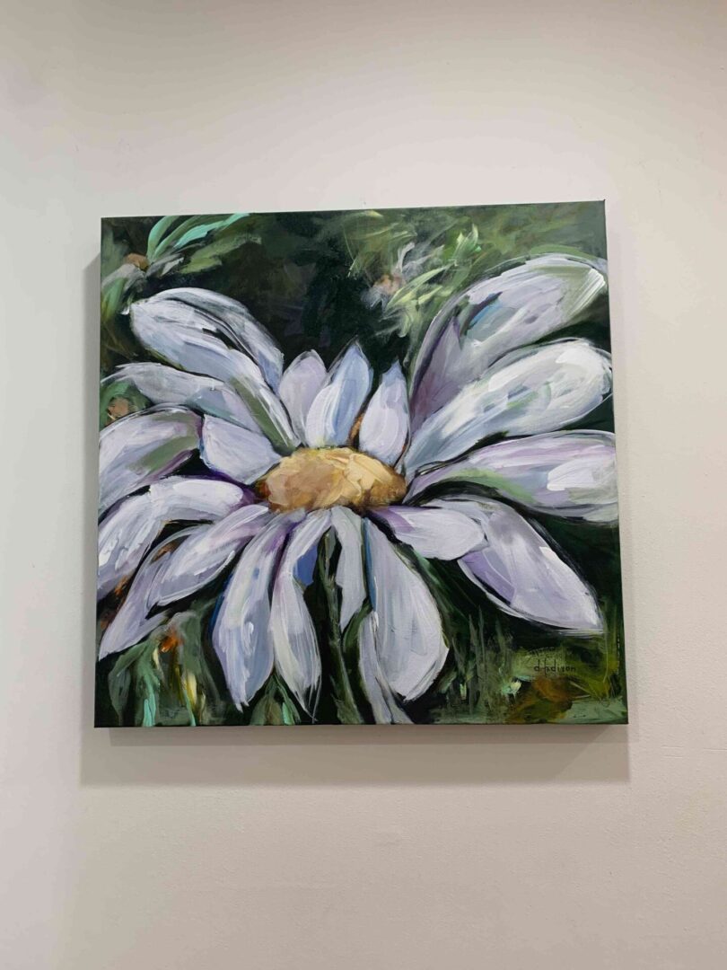 A painting of a white flower on the wall.